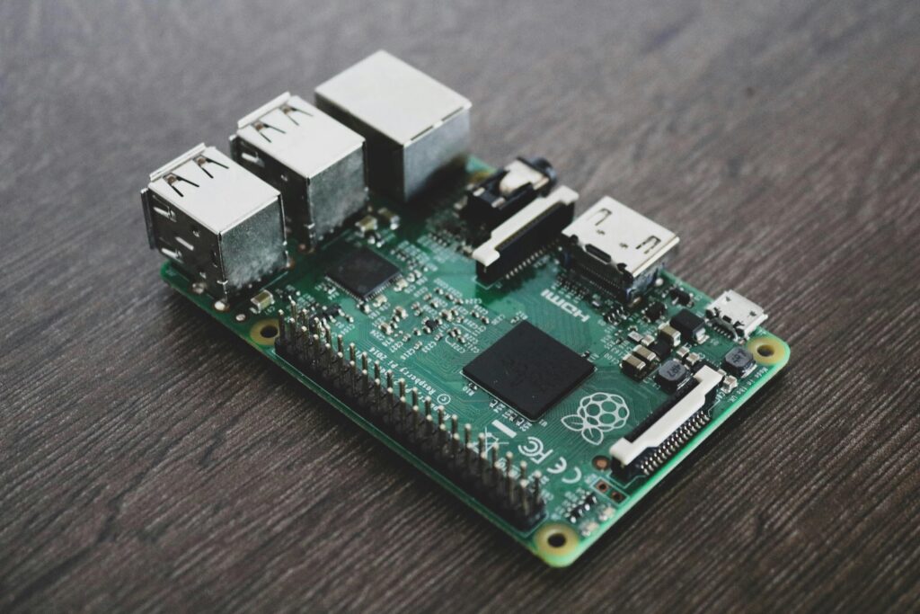Detailed view of a Raspberry Pi circuit board with microchips and components.